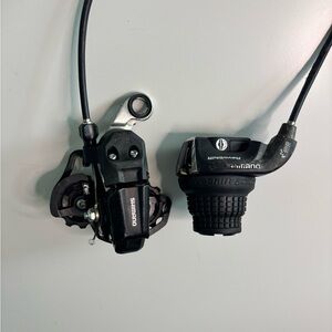 RevoShift Twist Shifter and a Shimano Tourney Rear Derailleur.